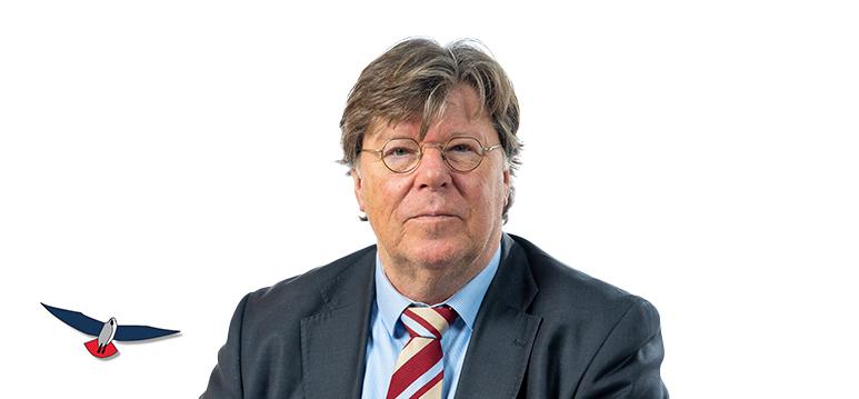 Portretfoto Tony van Dijck met partijlogo PVV